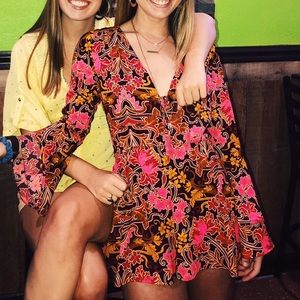 GB Long Sleeve Floral Romper with Plunging V-Neck!